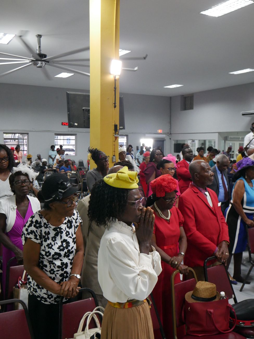 Pastor speaking to the congregation at Portmore New Testament Church of God